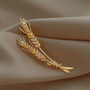 Brosa "Golden Pair" placata cu aur