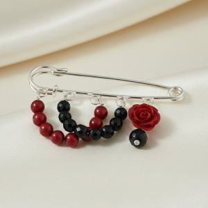 Brosa agrafa cu onix si coral rosu