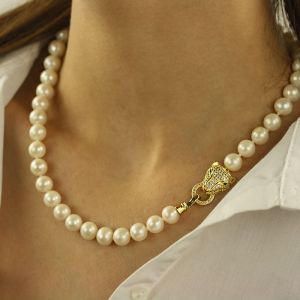 Colier exclusivist din perle naturale albe  9 - 10 mm AA si element auriu tigru