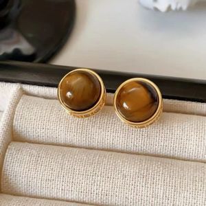 Cercei "Baffin" placati cu aur si ochi de tirgru